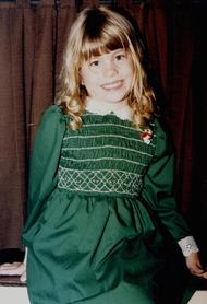 posing in a green dress